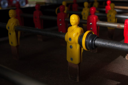 Close up view of a yellow player on a football toy.