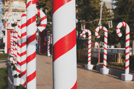 Big plastic tubes as candy canes for christmas.の写真素材