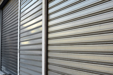 Metal gate protecting a store. Close shop. 
