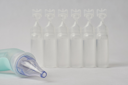 Plastic bottles of serum saline and a device of pulling out the mucus from the nose.の写真素材