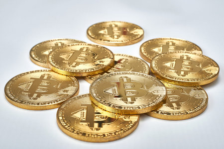Golden Bitcoins on white background.Virtual money.