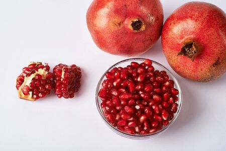 pomegranate fruits and seeds on white background.の写真素材