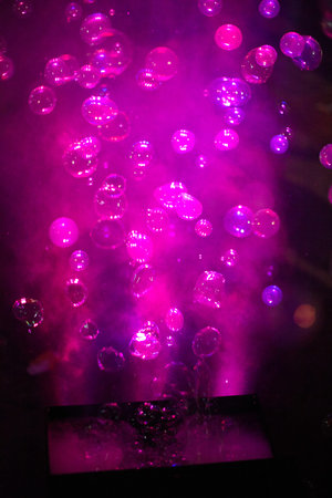 purple soap bubbles at night as background.Texture.