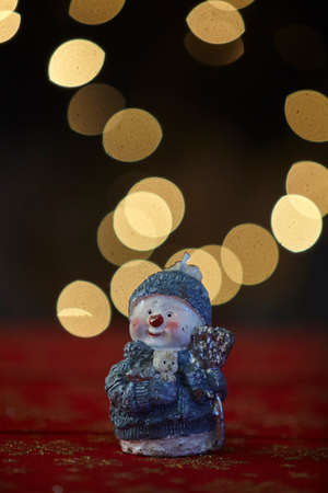 Christmas snowman ornament on lights background.の写真素材