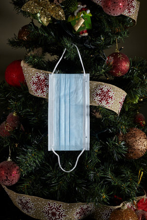 Christmas snowman ornament on lights background.
