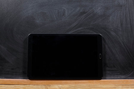 school blackboard and tablet as a background.の写真素材