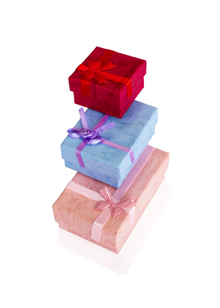 Three colored gift boxes on each other, on a white backgroundの写真素材
