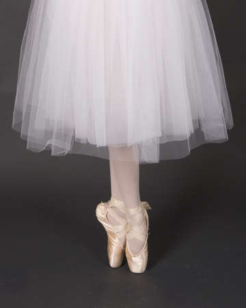 ballet shoes on dancer on pointの写真素材