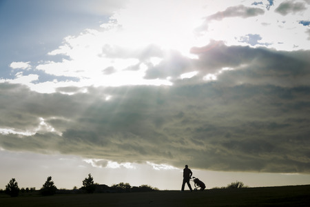 Sunburst and golferの写真素材