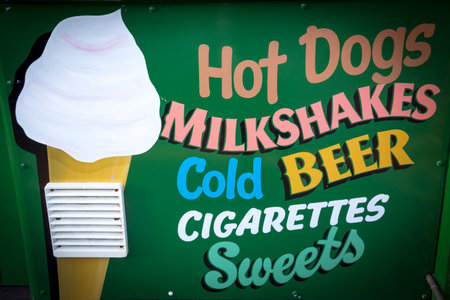 Seaside cafe menu sign with hot dogs and milkshakesの写真素材