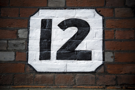 Number twelve hand painted on plaster backgroundの写真素材