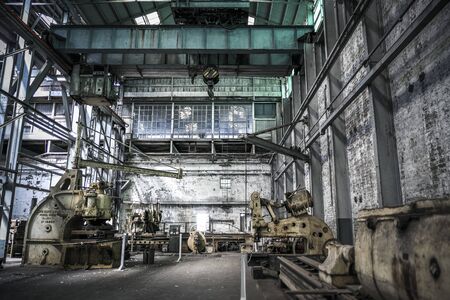 Industrial factory interior with heavy equipment and machineryの写真素材