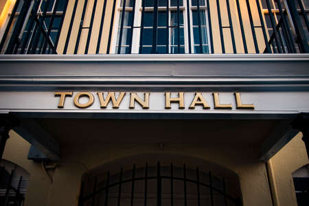 Golden lettering at entrance to council offices in English townの写真素材