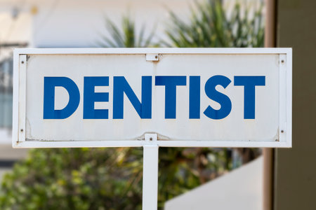 Dentist sign outside practitioner in bold blue and whiteの写真素材
