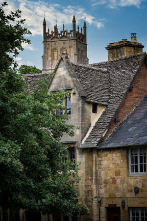 Church spire and buildings in the Cotswoldsの写真素材