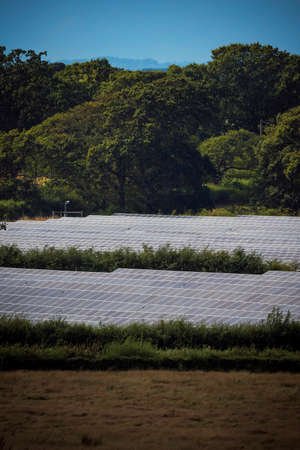Solar energy panels in countryside setting in sunshineの写真素材