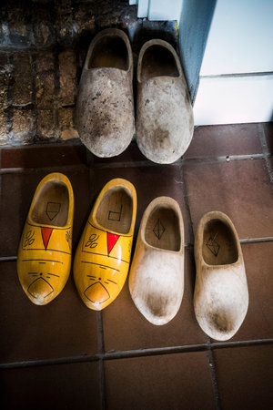 Traditional wooden clogs on tiled floor in the Netherlands