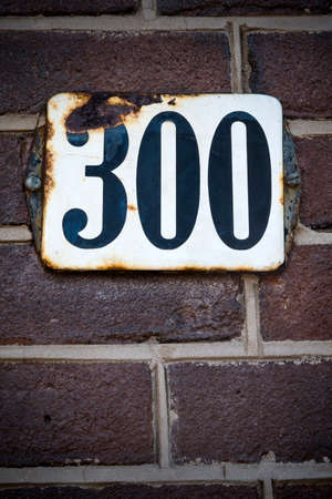 Number three hundred sign on brick wallの写真素材