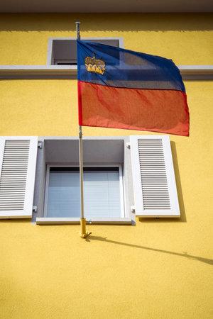 Flag of Liechtenstein on building in the capital Vaduzの写真素材