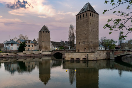 Strasbourg reflected in the River Ill at dusk in Alsace, Franceの写真素材
