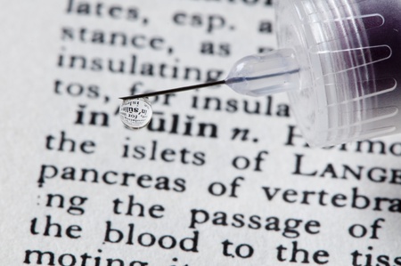 insulin description with insulin dripping on it の写真素材