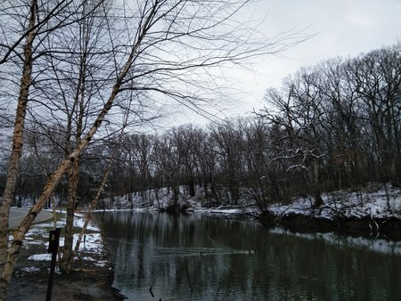 April Snow: snowy pondの写真素材
