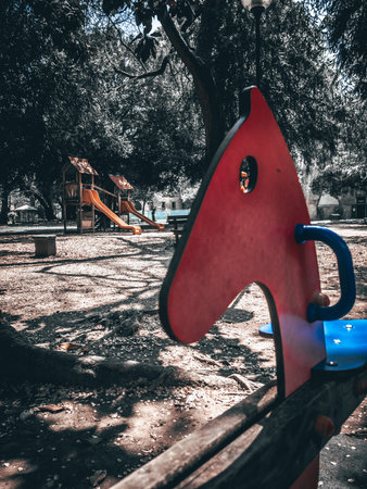 Playground in the park, vintage color tone. (selective focus)