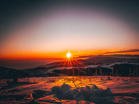 Beautiful winter sunrise in the mountains. Colorful winter landscape.の写真素材