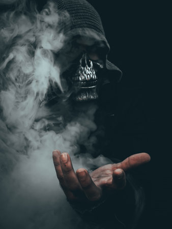 Skull in the smoke. The concept of death and death.の写真素材