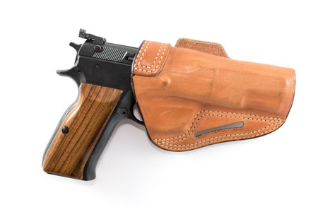 9mm Parabellum pistol in light brown leather holster