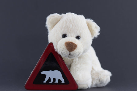 Stuffed Animal Polar Bear Cub with Warning Signの写真素材