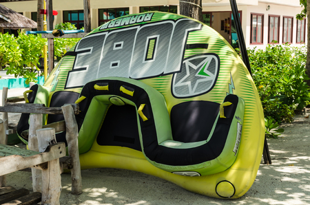 Maafushi Island, Maldives - November, 2017: Close-up: bright green sofa, Maafushi island, Maldives, Indian Ocean. The active form of relaxationのeditorial素材