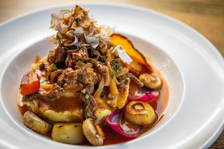 Beef meat strogonov with mashed potatoes, mushrooms, vegetables and sour cream sauceの写真素材