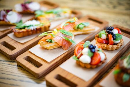 Salty ecler with fresh salmon on top and cheese insideの写真素材