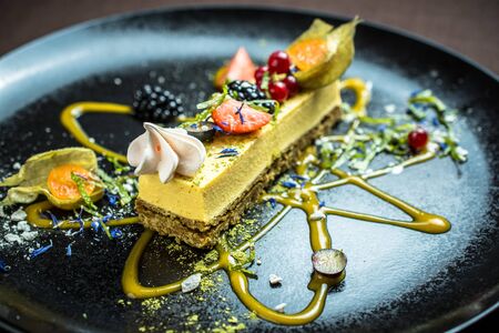 Cheese cake with fresh berries and meringue cookiesの写真素材