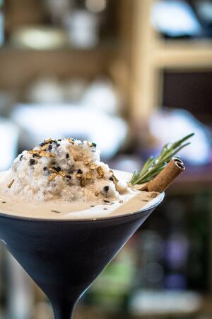 White latte coffee drink with a cookieの写真素材