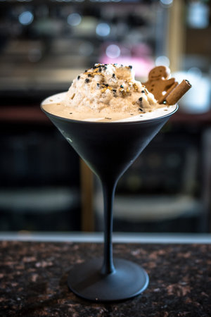 White latte coffee drink with a cookie