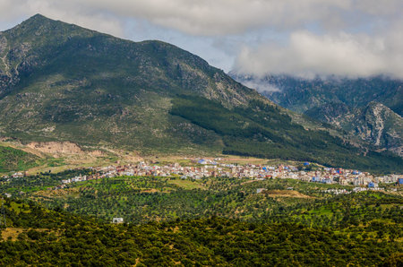 Panoramic view on the blue city of Chefchaouen in Morocco under the mountainsの写真素材