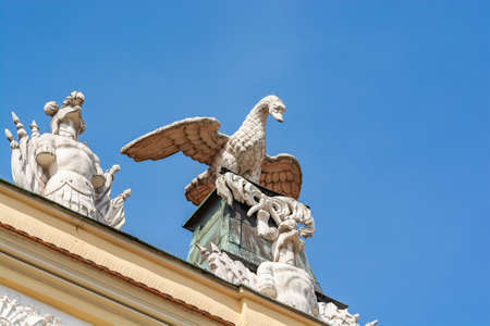 Poznan, Poland - August 09, 2021. Statues on the roof of Kornicka Library - Biblioteka Kornicka in Palac Dzialynskich with protection against pigeonsのeditorial素材