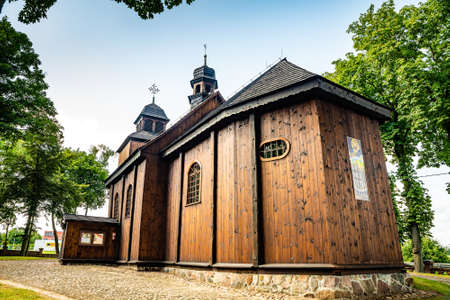 Lubowo, Poland - August 09, 2021. Old wooden st. Mikolaj Church - Kosciol pw. sw. Mikolajaのeditorial素材
