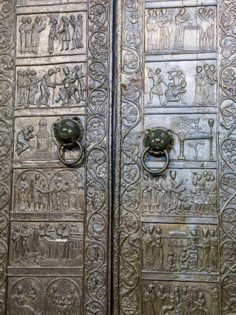 Gniezno, Poland - August 09, 2021. The Primatial Cathedral Basilica of the Assumption of the Blessed Virgin Mary and Shrine of St. Adalbert - Gniezno Doorsのeditorial素材