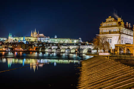Prague, Czech republic - December 29, 2021. Winter night photo of Prague Castle with Novotneho lavkaのeditorial素材