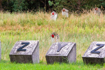 Torun, Poland - August 20, 2021. Old abandoned soviet cemetery - Cementarz Jencow Wojennychのeditorial素材