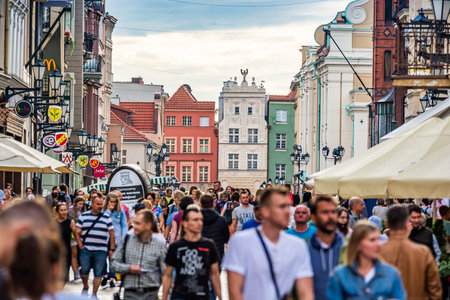 Torun, Poland - August 11, 2021. Picturesque old buildings in crossing streets Rozana and Piekary in...