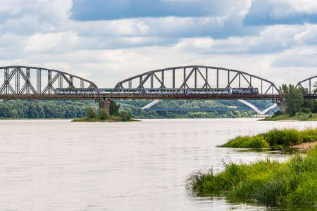 Torun, Poland - August 11, 2021. Ernest Malinowski Railway Bridge - Most kolejowy im. Ernest Malinowski - in Summerのeditorial素材