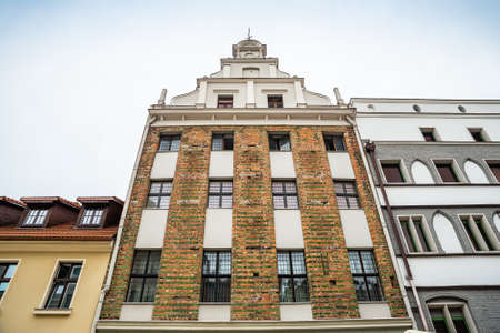 Torun, Poland - August 11, 2021. One of the oldest buildings - Dawny dom kompanijny kupcow bractwa Mariackiego - in street Zeglarska nr 5のeditorial素材