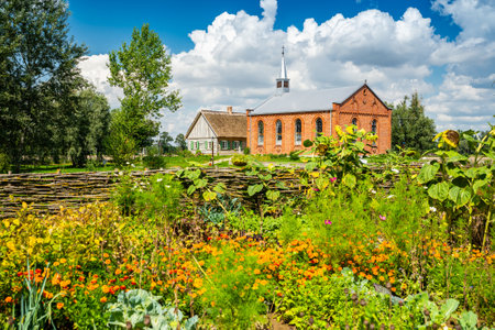Wiaczemin Polski, Poland - August 12, 2021. Open-air museum of the Vistula settlement - Skansen Osadnictwa Nadwislanskiego - church and schoolのeditorial素材