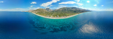 Large panorama of 7 km long beach in village Borsh, Albania in Summer 2022の写真素材