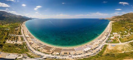 Large panorama of 7 km long beach in village Borsh, Albania in Summer 2022の写真素材