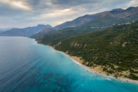 Aerial view of green shore with huge rocks by Bunec Beach area in Summer 2022, Albaniaの写真素材